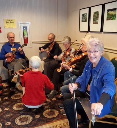 A few members of David Kaynor's Fiddle Orchestra jamming - at a fiddle festival & one saw!